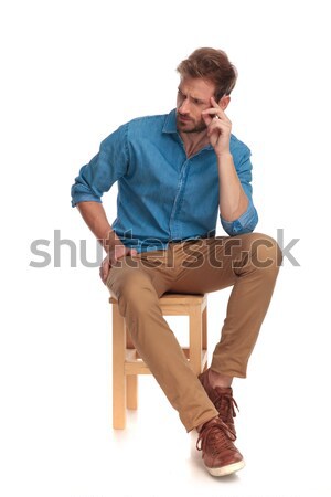 seated casual man focusing on something  Stock photo © feedough