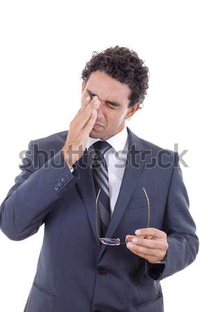 man with a headache holding glasses Stock photo © feelphotoart