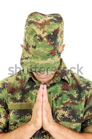 Soldier in camouflage uniform kneeling holding flower Stock photo © feelphotoart