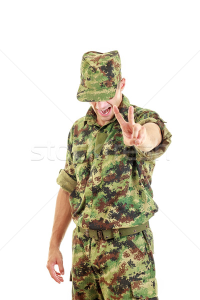 angry soldier with hidden face in green camouflage uniform and h Stock photo © feelphotoart