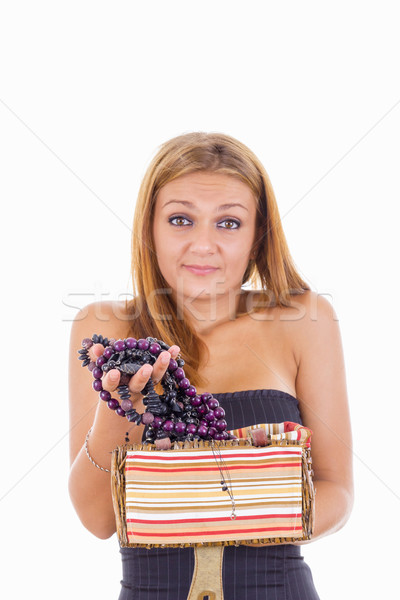 confused girl takes out jewelery from jewelry box Stock photo © feelphotoart