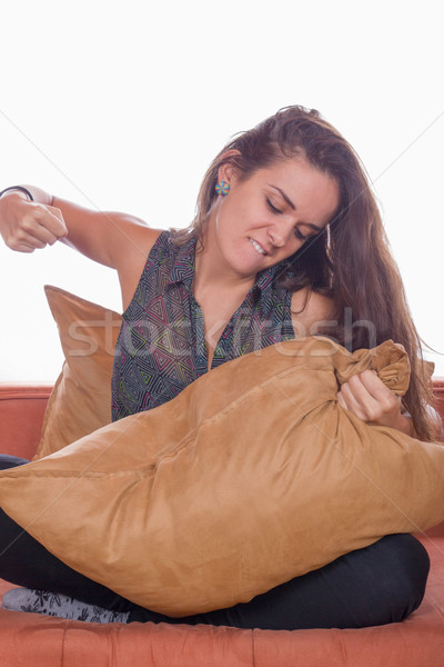 angry woman hits the pillow Stock photo © feelphotoart