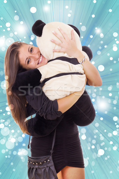 smiling thrilled business woman hugging teddy bear Stock photo © feelphotoart