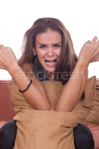 girl screaming and hugging pillow Stock photo © feelphotoart
