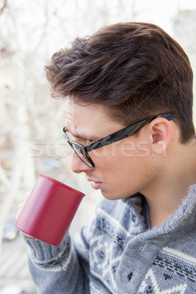 man with glasses drinking coffee Stock photo © feelphotoart