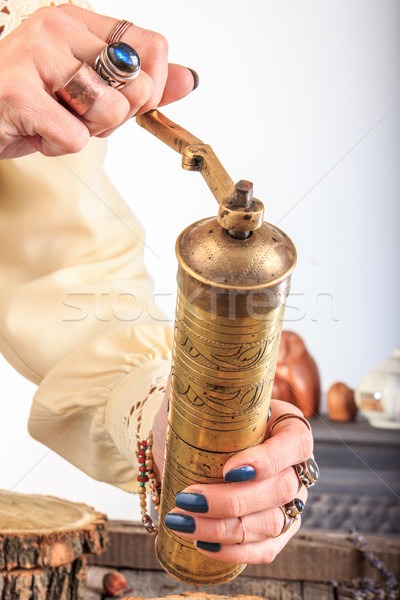 Woman holding old coffee grinder Stock photo © feelphotoart