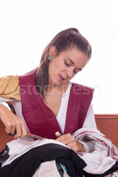 girl cutting fabric and clothes with scissors Stock photo © feelphotoart