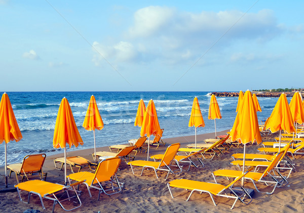 Sunbeds and beach umbrellas. Stock photo © FER737NG
