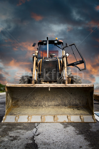 Bulldozer jaune tracteur dramatique ciel travaux Photo stock © Fernando_Cortes