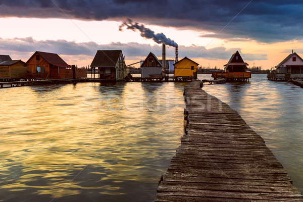 Puesta de sol lago muelle pesca Foto stock © Fesus