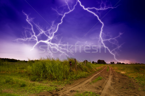 Rural road and lighting storm Stock photo © Fesus