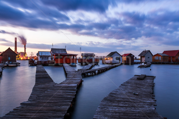 Puesta de sol lago muelle pesca Foto stock © Fesus