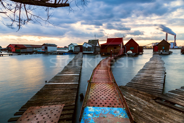 Puesta de sol lago muelle pesca Foto stock © Fesus