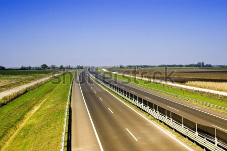 Cars speeding on a highway Stock photo © Fesus