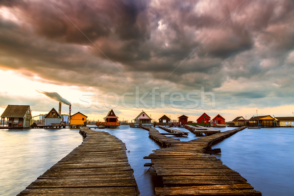 Puesta de sol lago muelle pesca Foto stock © Fesus