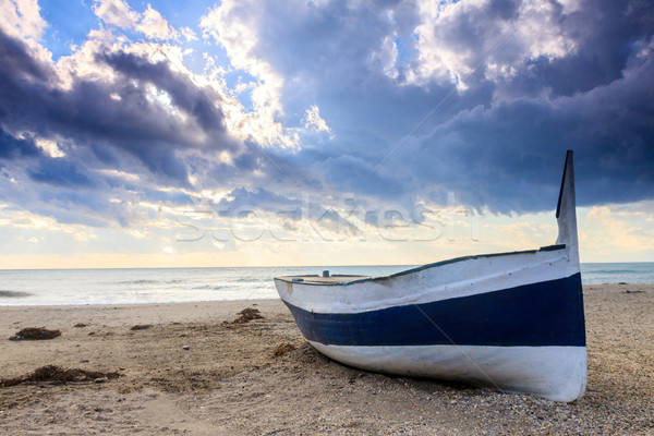 Boat on the beach at sunset time Stock photo © Fesus