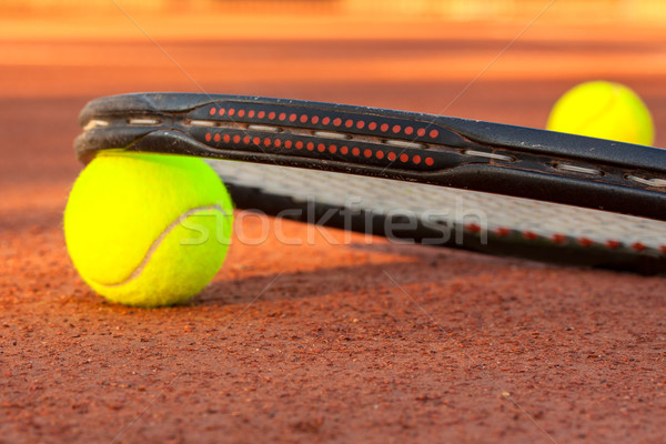 Tennis ball and racquet on a tennis clay court Stock photo © Fesus