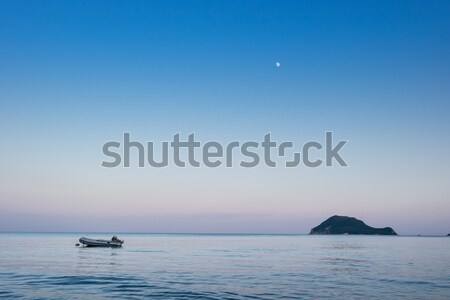 Lonely traditional greek fishing boat on sea water Stock photo © Fesus