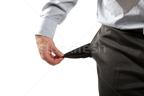 Disappointed businessman with empty pockets isolated over white  Stock photo © Fesus