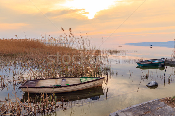 Sunset on the lake Balaton with a boat Stock photo © Fesus