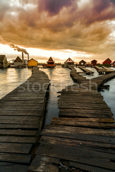 Puesta de sol lago muelle pesca Foto stock © Fesus