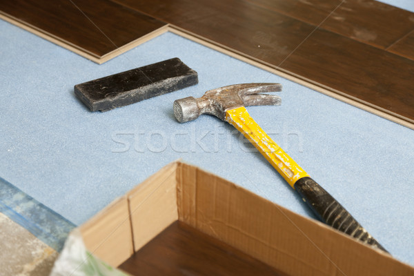 Hammer and Block with New Laminate Flooring Stock photo © feverpitch