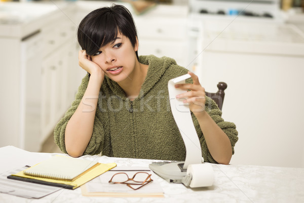 Multi-ethnic Young Woman Agonizing Over Financial Calculations Stock photo © feverpitch