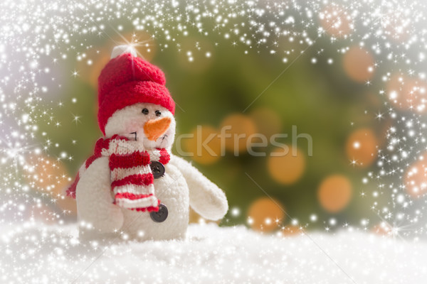 Stock photo: Cute Snowman Over Abstract Snow and Light Background
