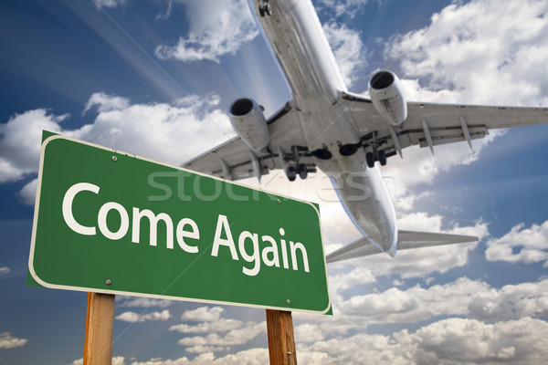 Come Again Green Road Sign and Airplane Above Stock photo © feverpitch