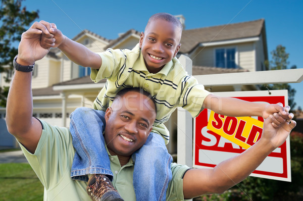 Father and Son In Front of Real Estate Sign and Home Stock photo © feverpitch