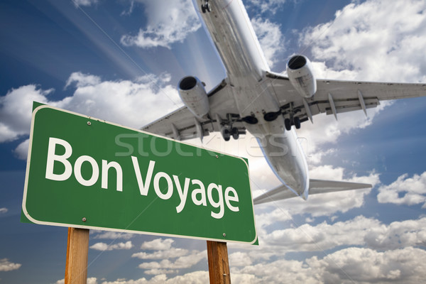Bon Voyage Green Road Sign and Airplane Above Stock photo © feverpitch