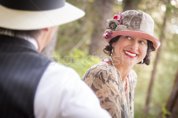 1920s Dressed Romantic Couple Flirting Outdoors Stock photo © feverpitch