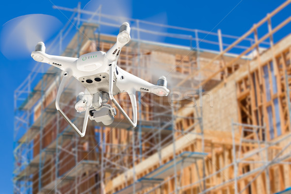 Drone Quadcopter Flying and Inspecting Construction Site Stock photo © feverpitch