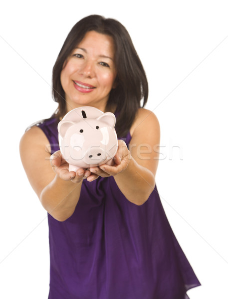 Smiling Hispanic Woman Holding Piggy Bank on White Stock photo © feverpitch