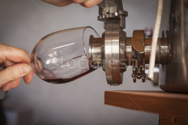 Vintner Pours Taste of Wine from Barrel into Glass Stock photo © feverpitch