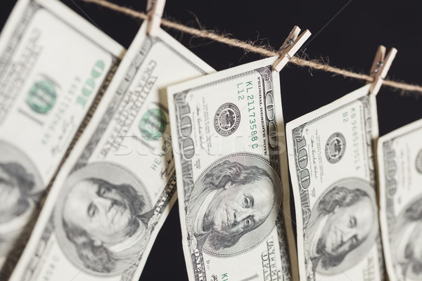 Száz dollár bankjegyek akasztás ruhaszárító sötét üzlet Stock fotó © feverpitch
