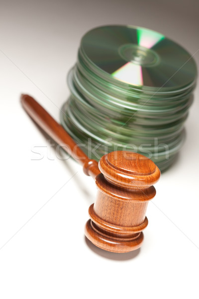 Stock photo: Stack of CD Rom or DVD Discs and Gavel