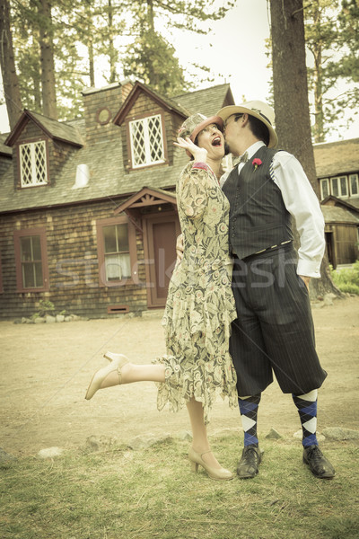1920s Dressed Romantic Couple in Front of Old Cabin Stock photo © feverpitch