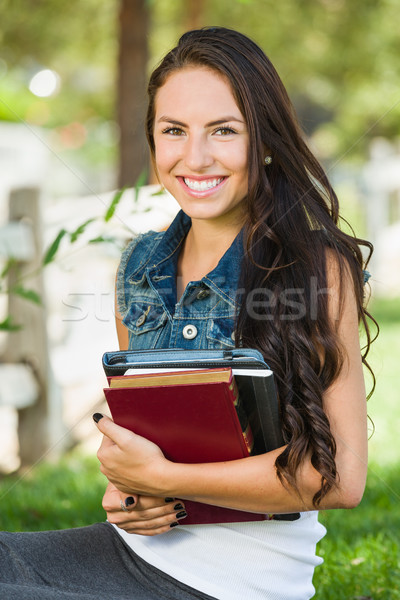 Attractive Smiling Mixed Race Young Girl Student with School Boo Stock photo © feverpitch