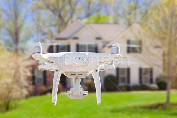 Back of Unmanned Aircraft System (UAV) Quadcopter Drone Flying I Stock photo © feverpitch