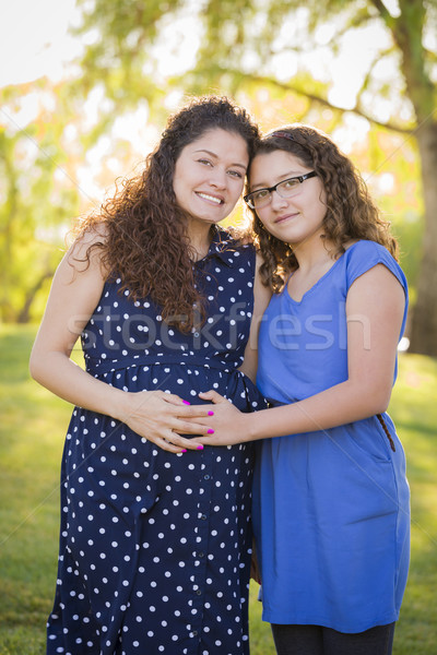 Hispanic Daughter Feels Baby Kick in Pregnant Mother’s Tummy  Stock photo © feverpitch