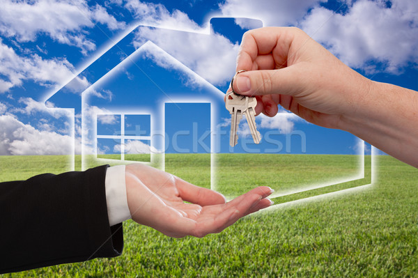 Handing Over Keys on Ghosted Home Icon, Grass Field and Sky Stock photo © feverpitch
