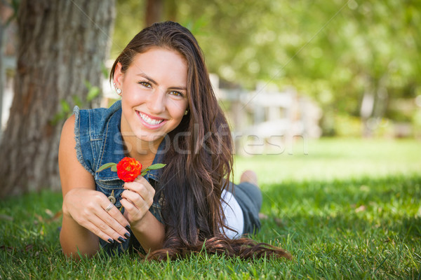 Attractive Mixed Race Girl Portrait Laying in Grass Outdoors wit Stock photo © feverpitch