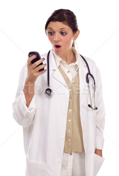 Ethnic Female Doctor or Nurse Using Cell Phone Stock photo © feverpitch