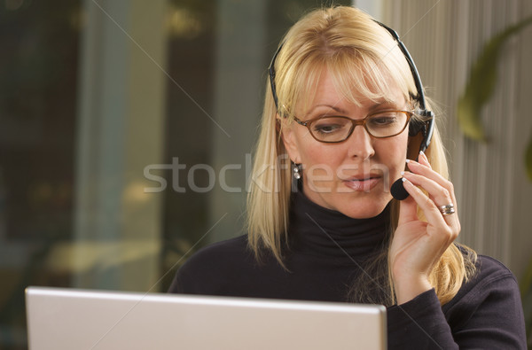 Attractive Businesswoman with Phone Headset Stock photo © feverpitch