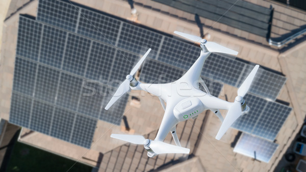 UAV Drone Inspecting Solar Panels On Large House Stock photo © feverpitch