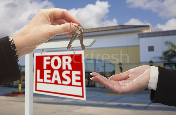 Stock photo: Handing Over Keys in Front of Business Office and Sign