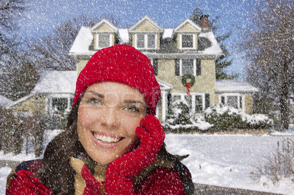 Smiling Mixed Race Woman in Winter Clothing Outside in Snow Stock photo © feverpitch