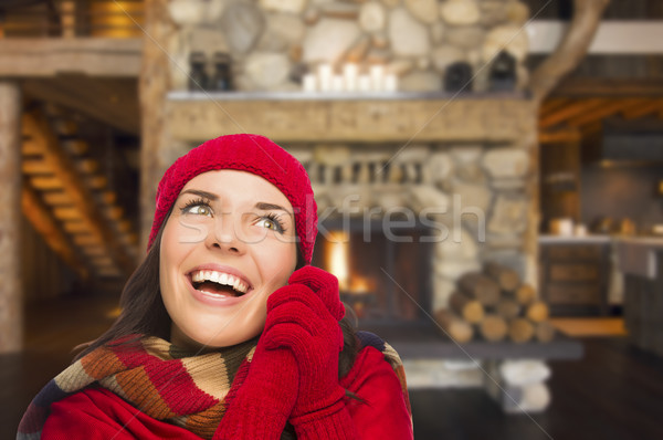 Mixed Race Girl Enjoying Warm Fireplace In Rustic Cabin Stock photo © feverpitch