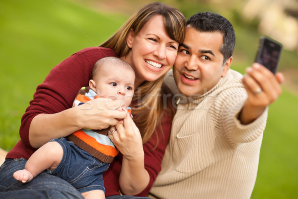 Boldog félvér szülők baba fiú elvesz Stock fotó © feverpitch